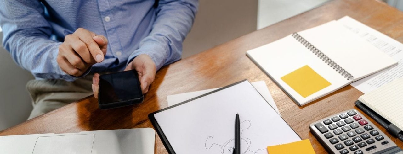 business person holding phone